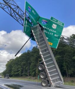 Bed of a truck crashed into a highway sign