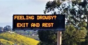 highway sign telling drowsy drivers to pull over