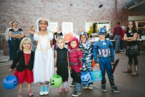 trick or treaters in Halloween costumes