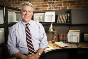 Edward L. Allen with desk behind him