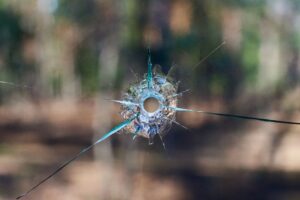 bullet hole through window