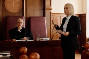 woman speaking in court to prove a case